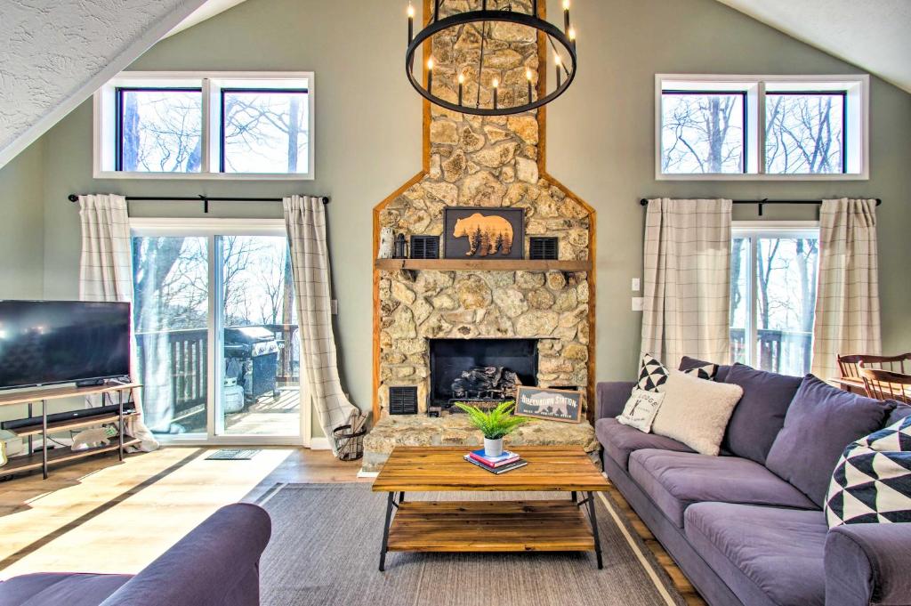 a living room with a couch and a fireplace at Wintergreen Resort Retreat - Walk to Slopes! in Lyndhurst