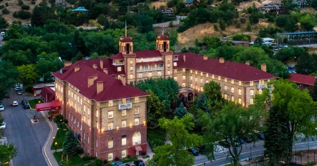 an overhead view of a large building with a red roof at Hotel Colorado in Glenwood Springs
