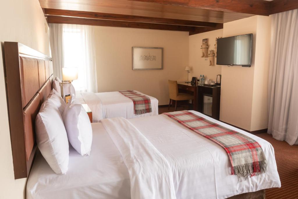 Postel nebo postele na pokoji v ubytování Casa Andina Premium Miraflores