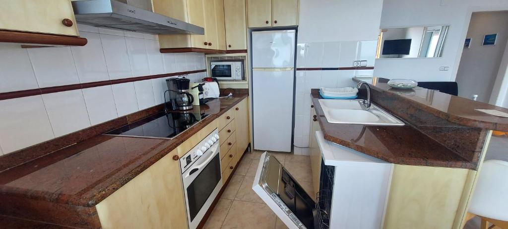 Kuchyň nebo kuchyňský kout v ubytování Appartement Artit D1