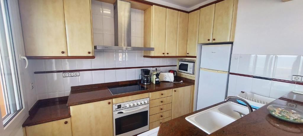 Kuchyň nebo kuchyňský kout v ubytování Appartement Artit D1
