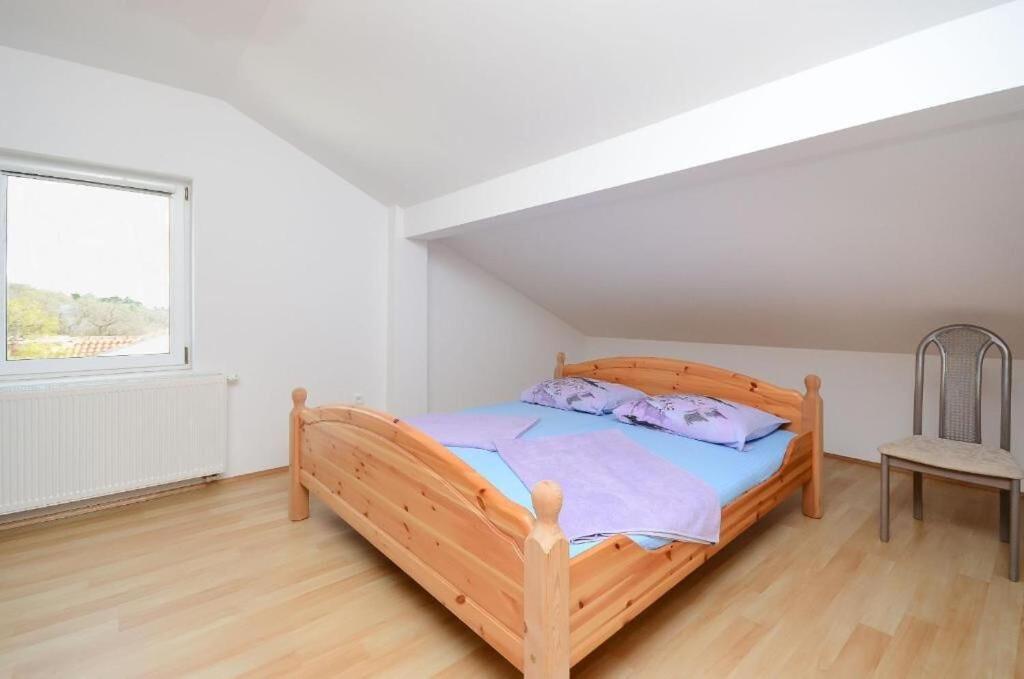 Postel nebo postele na pokoji v ubytování Apartments Bozana