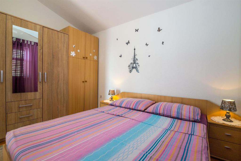 Postel nebo postele na pokoji v ubytování Apartments Tolj