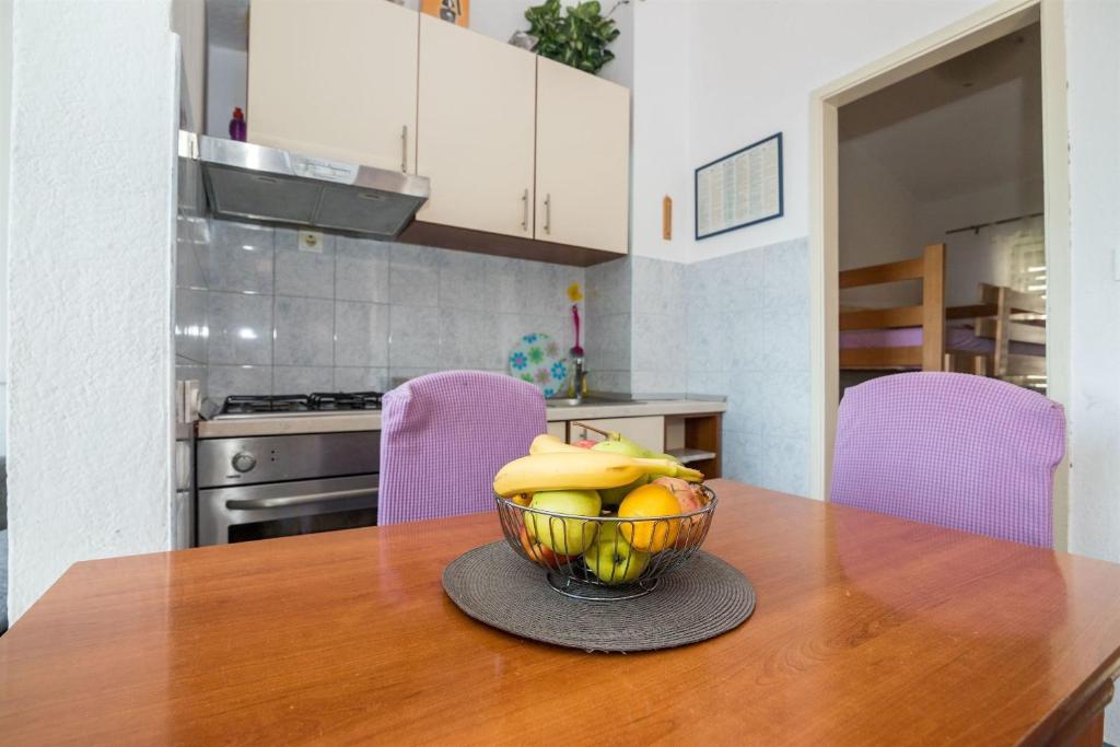 Kuchyň nebo kuchyňský kout v ubytování Apartments Tolj