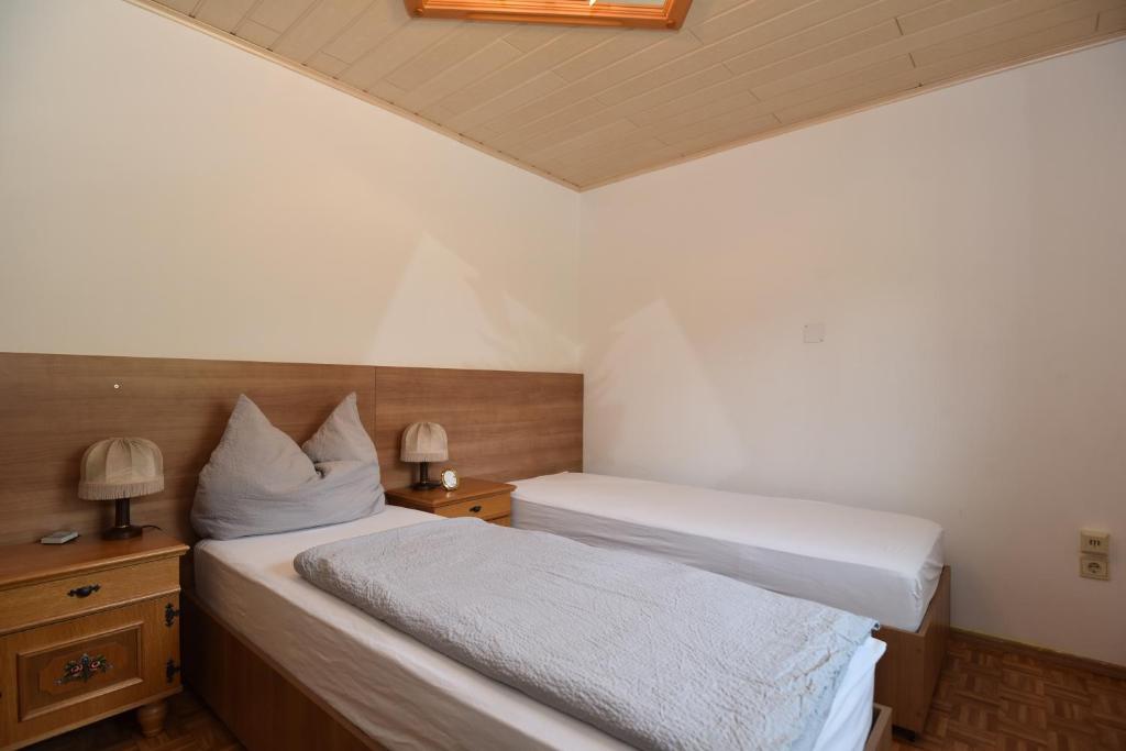 Postel nebo postele na pokoji v ubytování PM-APART Ries Rosina