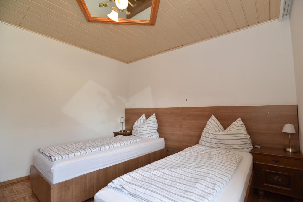 Postel nebo postele na pokoji v ubytování PM-APART Ries Rosina
