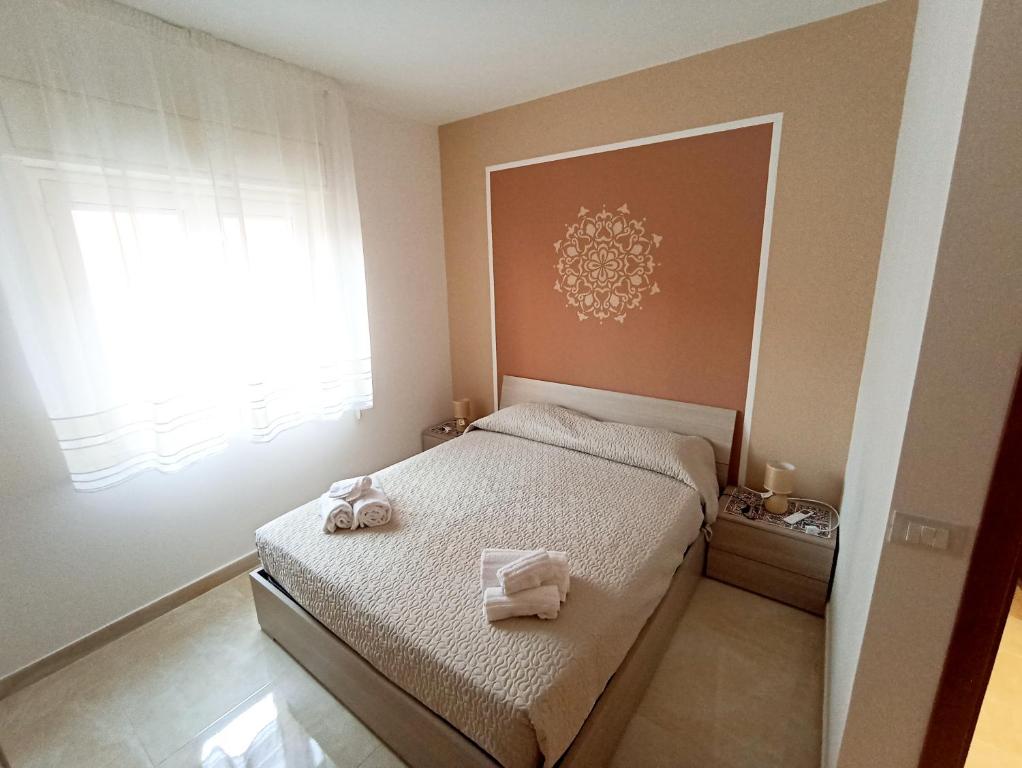 Ένα ή περισσότερα κρεβάτια σε δωμάτιο στο Marisol Apartment