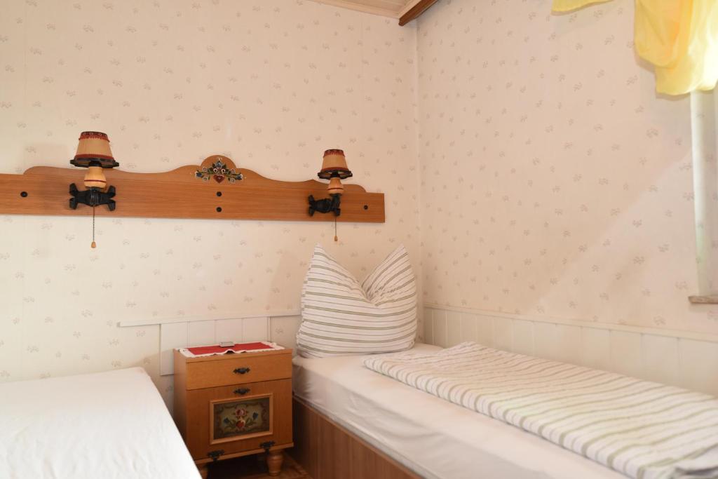 Postel nebo postele na pokoji v ubytování PM-APART Ries Rosina