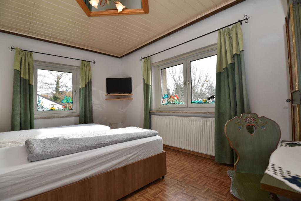 Postel nebo postele na pokoji v ubytování PM-APART Ries Rosina