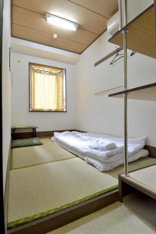 Postel nebo postele na pokoji v ubytování Juyoh Hotel