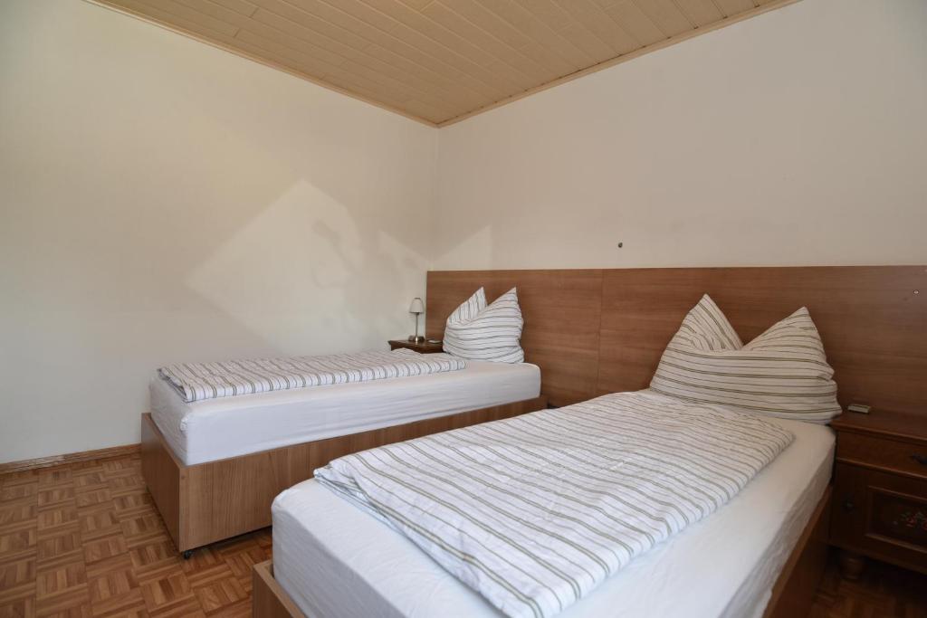 Postel nebo postele na pokoji v ubytování PM-APART Ries Rosina