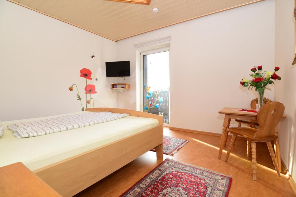 Postel nebo postele na pokoji v ubytování PM-APART Ries Rosina