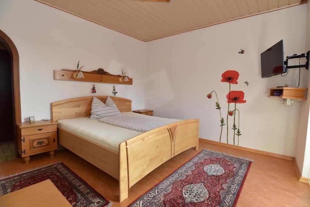 Postel nebo postele na pokoji v ubytování PM-APART Ries Rosina