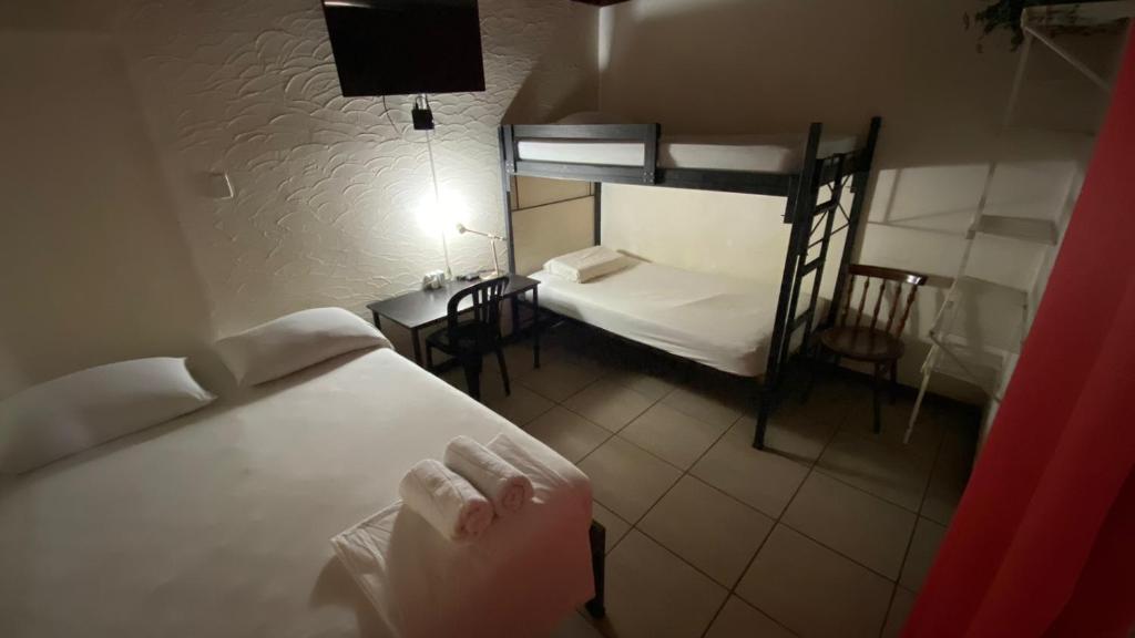 Postel nebo postele na pokoji v ubytování Hostel Pura Vida en Liberia