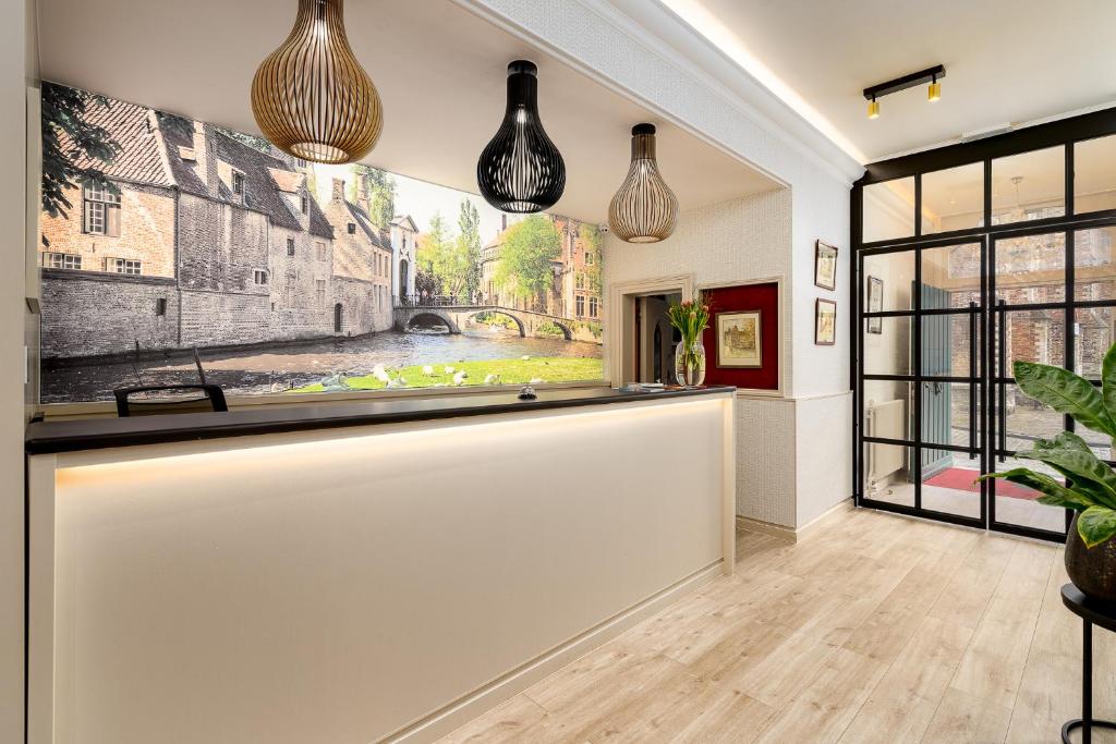 a living room with a large painting on the wall at Hotel Jacobs in Bruges