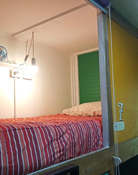Postel nebo postele na pokoji v ubytování Kapai Hostel