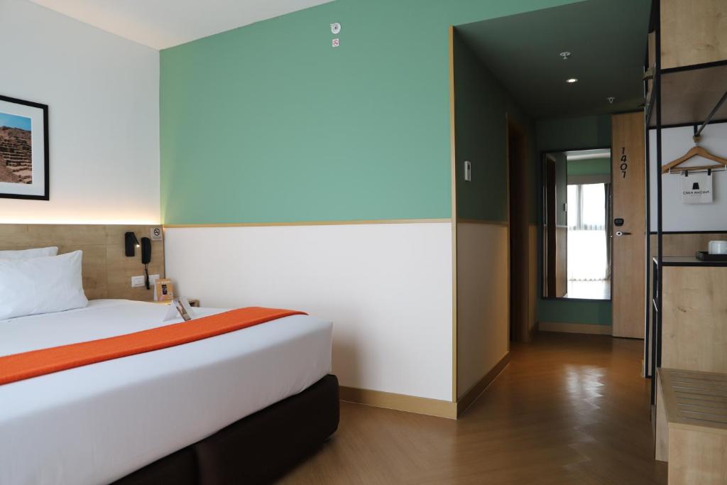 Postel nebo postele na pokoji v ubytování Casa Andina Standard Benavides