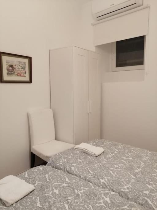Postel nebo postele na pokoji v ubytování CASA DA PRAIA DA POÇA - APARTAMENTO TULIPA
