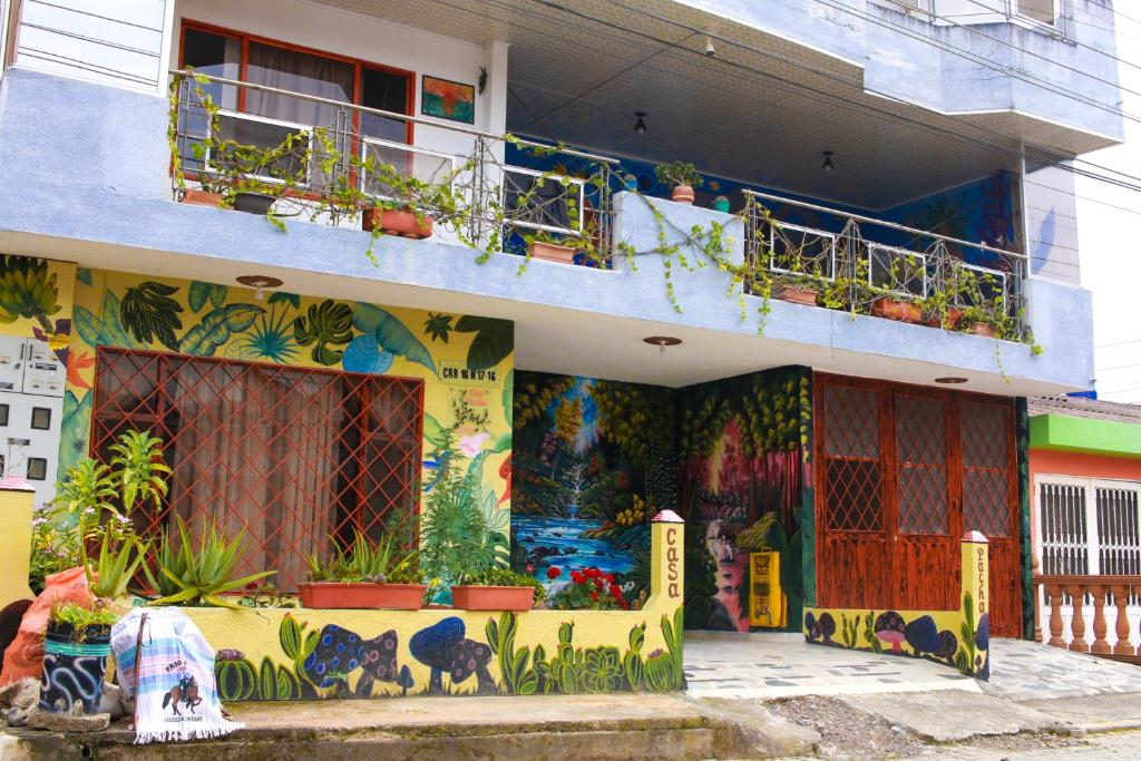 a building with a mural on the side of it at Casa Pacha in Guaduas