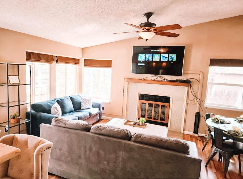 a living room with a couch and a fireplace at Pet Friendly 2 King Beds AF Academy Sleeps 12 in Colorado Springs
