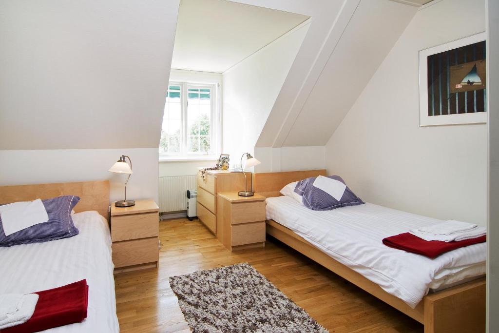 Postel nebo postele na pokoji v ubytování Abbekås Golfrestaurang & Hotell