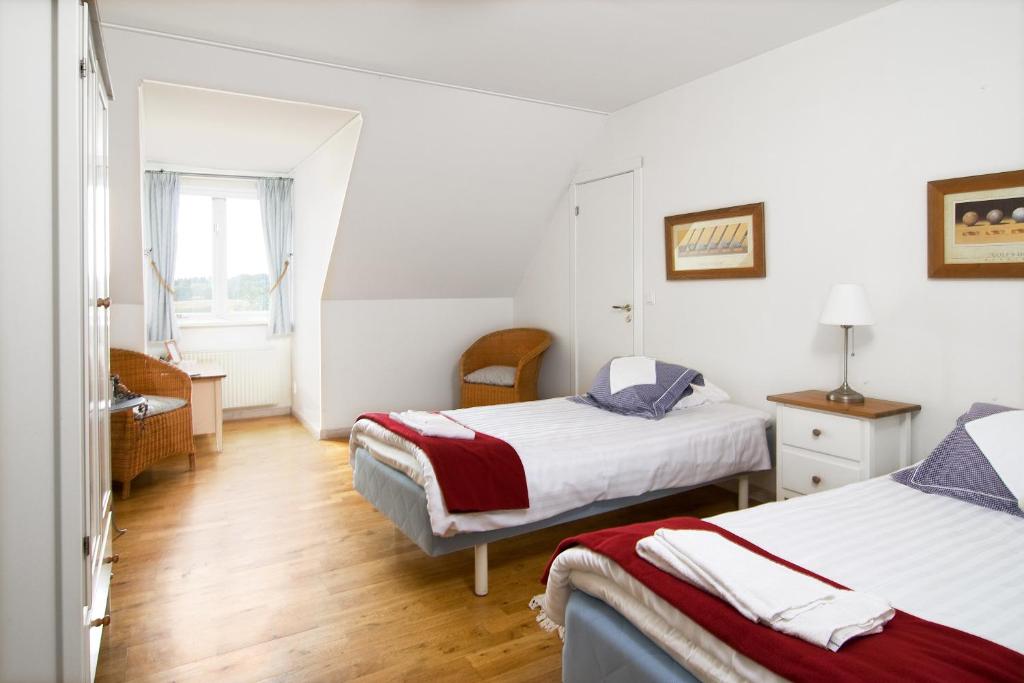 Postel nebo postele na pokoji v ubytování Abbekås Golfrestaurang & Hotell