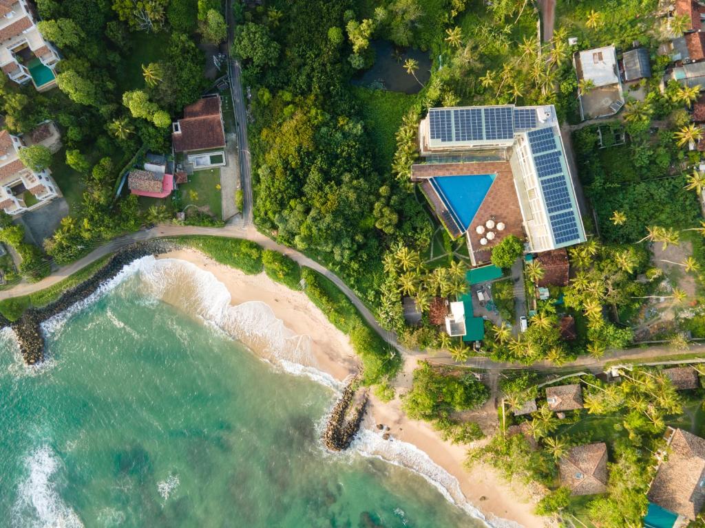 an aerial view of a resort on a beach at Ayurvie Weligama - Ayurvedic Retreat by Thema Collection in Weligama