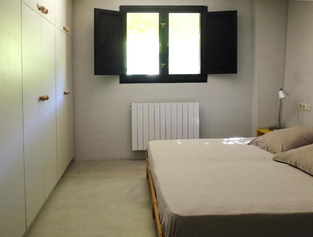 Cama o camas de una habitación en Ca L'Olier