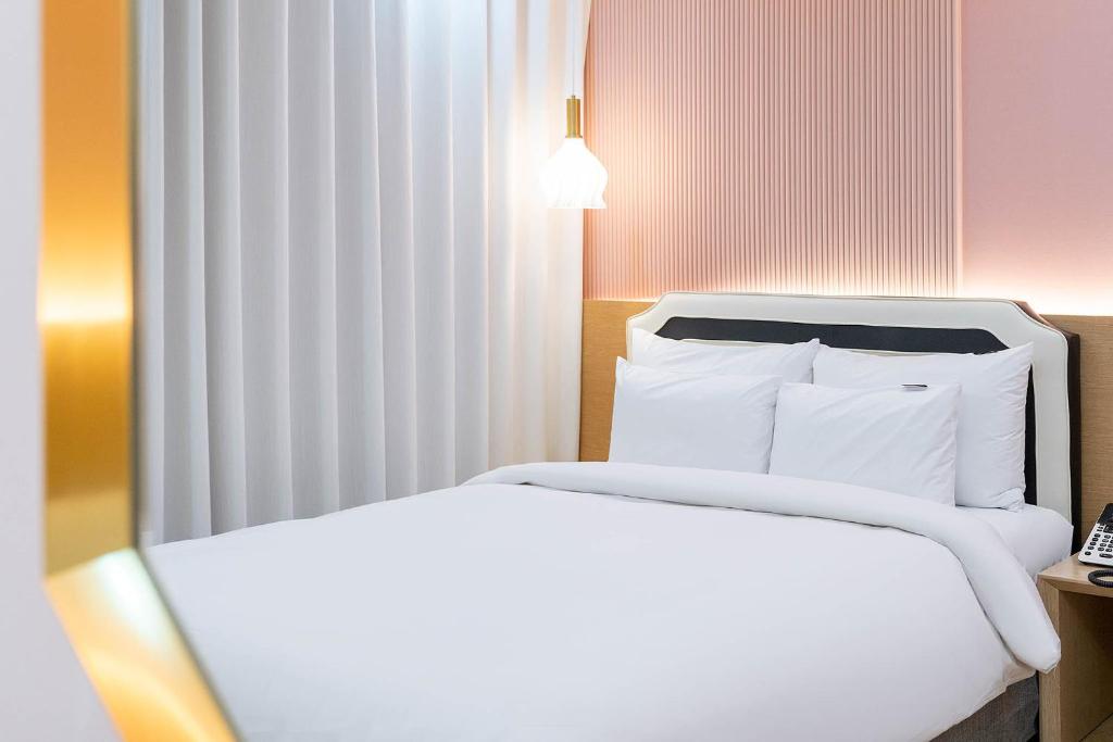 Postel nebo postele na pokoji v ubytování Browndot Hotel Namchuncheon