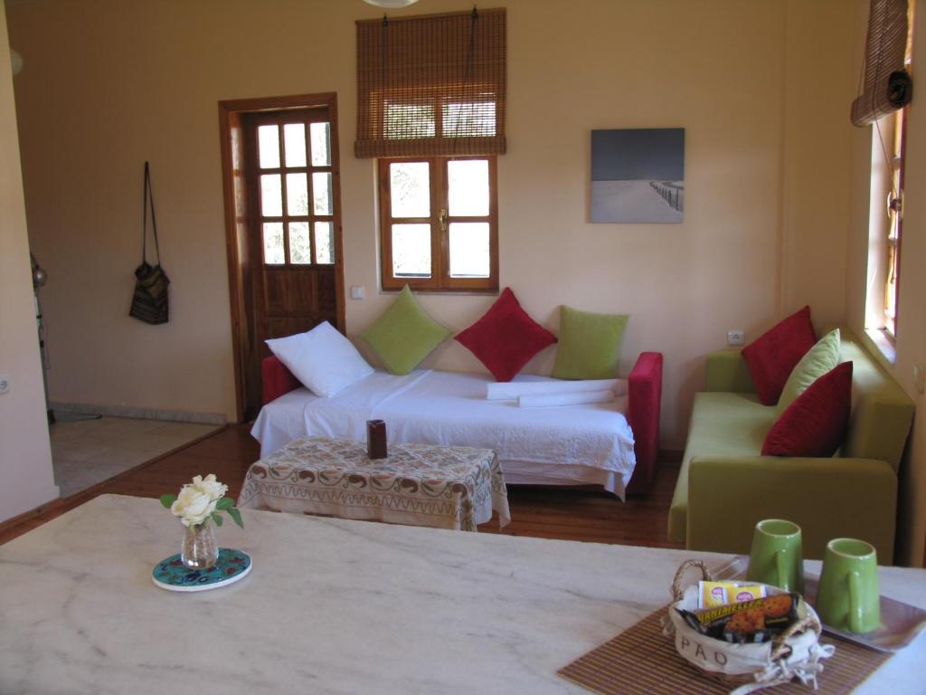 A bed or beds in a room at Pasha Apart Hotel