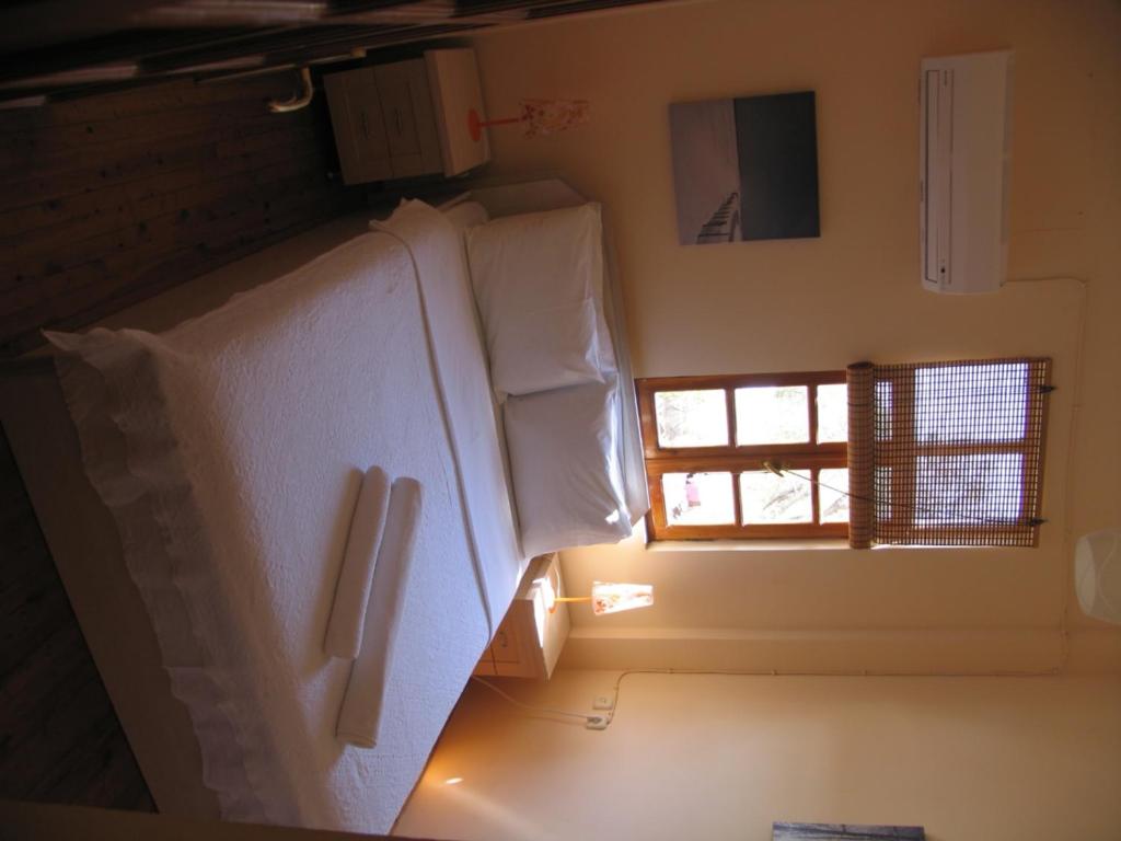 A bed or beds in a room at Pasha Apart Hotel