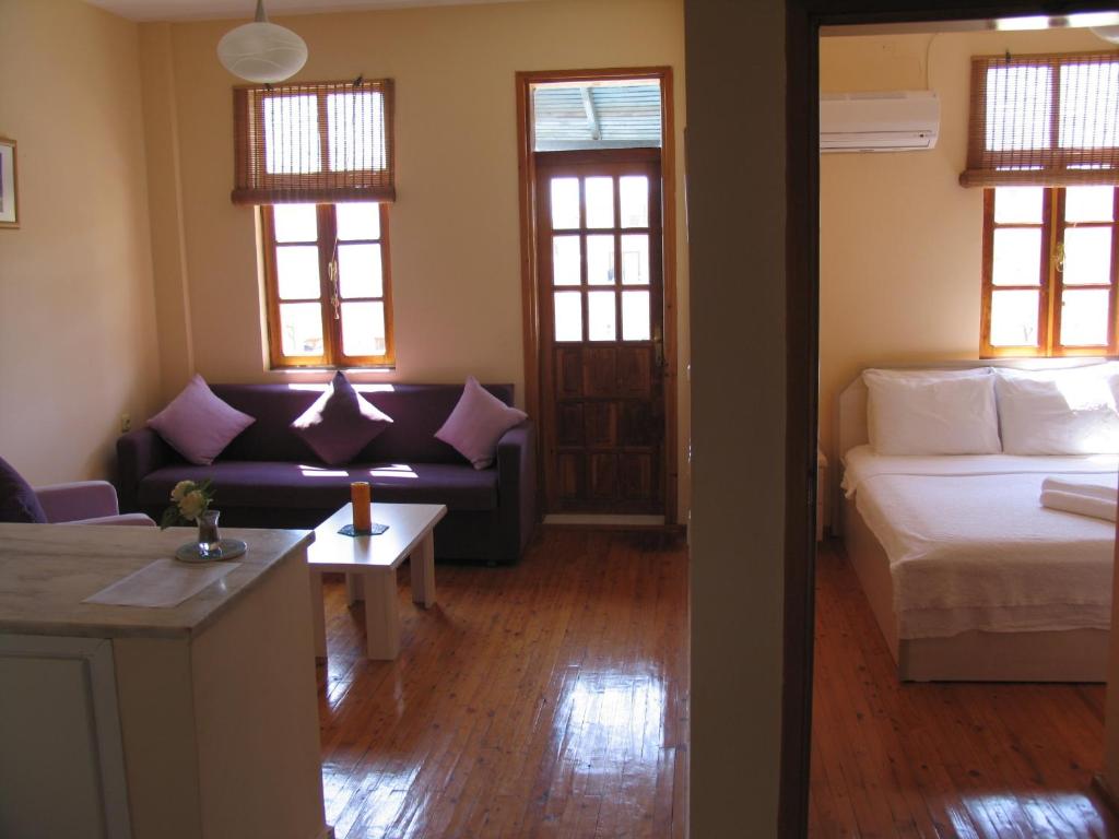 A bed or beds in a room at Pasha Apart Hotel