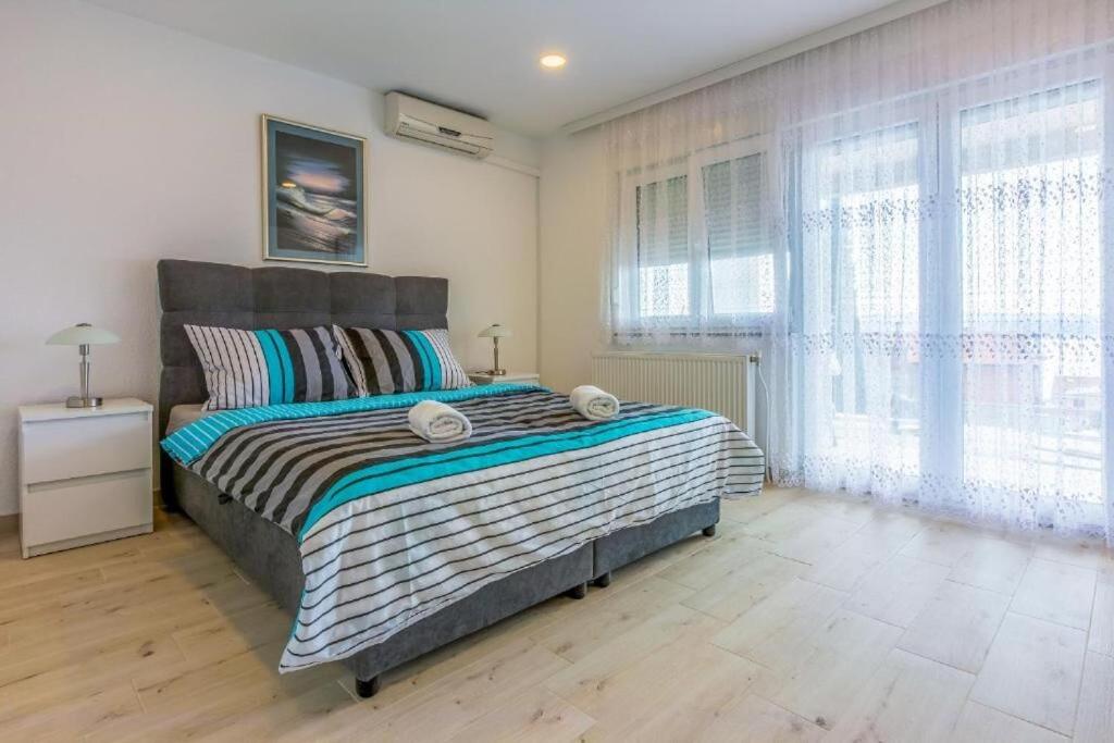 Postel nebo postele na pokoji v ubytování Apartments Cvetkovic