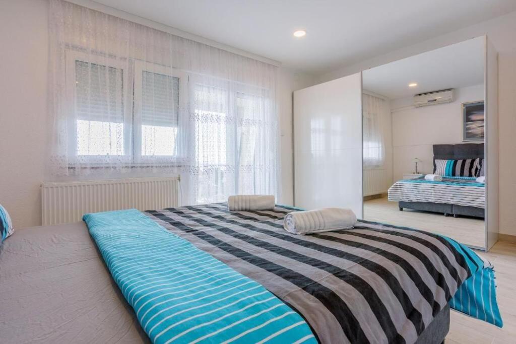 Postel nebo postele na pokoji v ubytování Apartments Cvetkovic