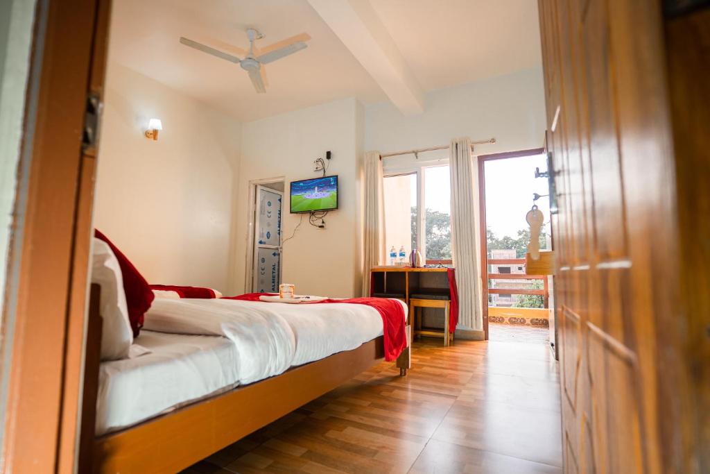 Postel nebo postele na pokoji v ubytování Hotel Dela Mount Pokhara
