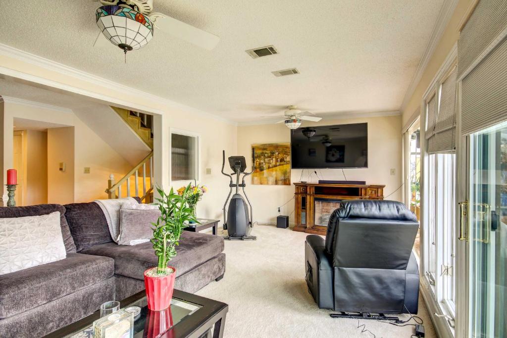 a living room with a couch and a table at Waterfront Vacation Rental on Savannah River! in Augusta