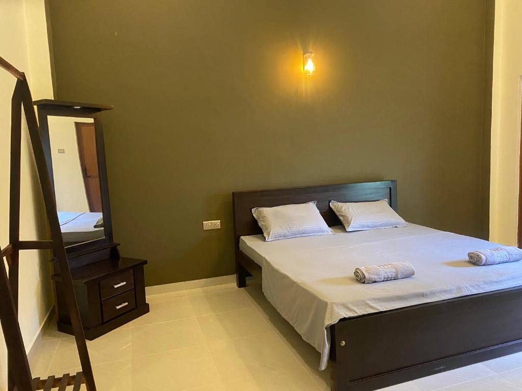 Postel nebo postele na pokoji v ubytování Negombo 146 Homestay