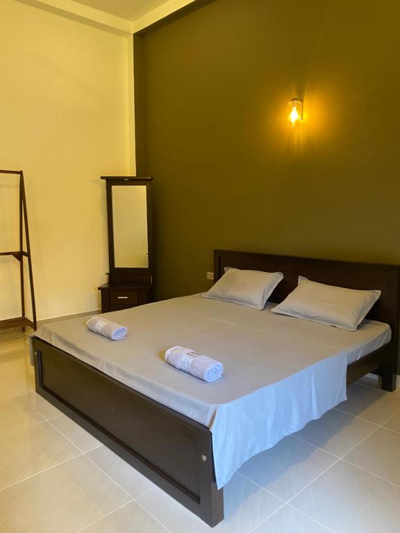 Postel nebo postele na pokoji v ubytování Negombo 146 Homestay