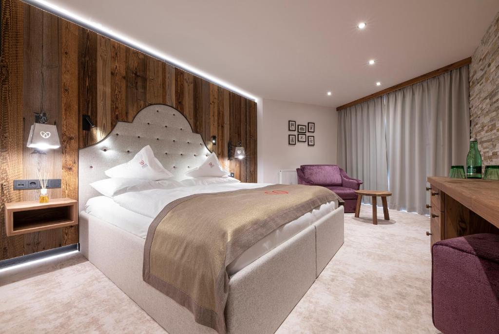 Postel nebo postele na pokoji v ubytování Superior Hotel Edelweiss