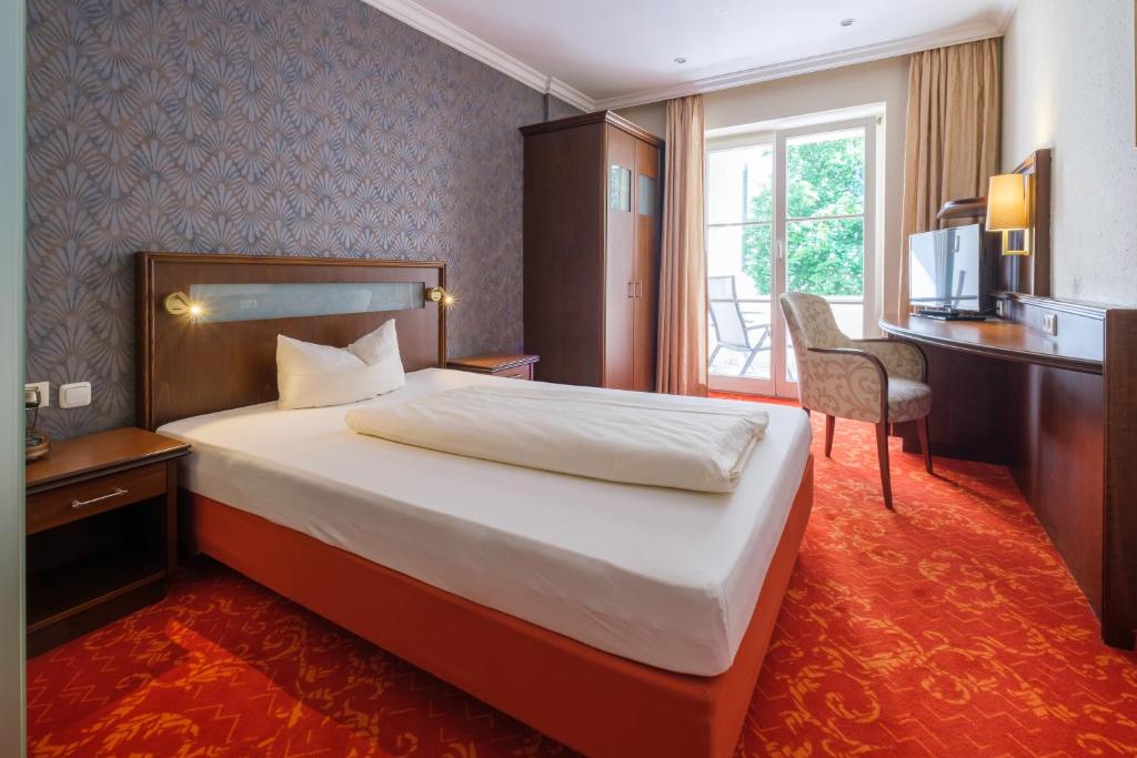 Postel nebo postele na pokoji v ubytování Hotel Mohren