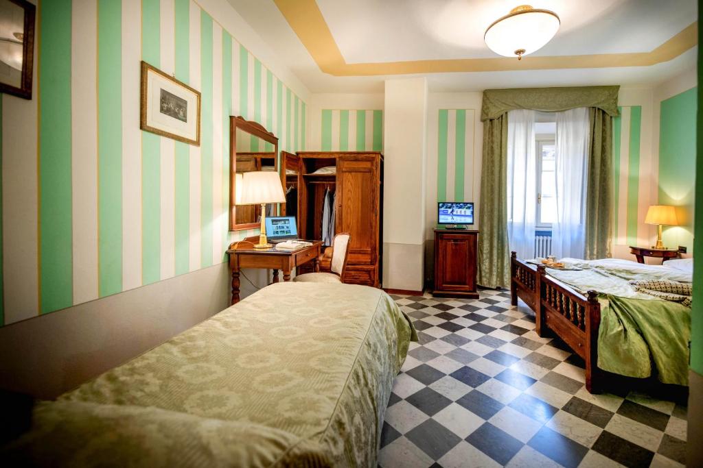 Postel nebo postele na pokoji v ubytování Park Hotel Regina - with air-condition and pool