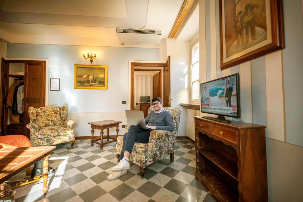 TV a/nebo společenská místnost v ubytování Park Hotel Regina - with air-condition and pool