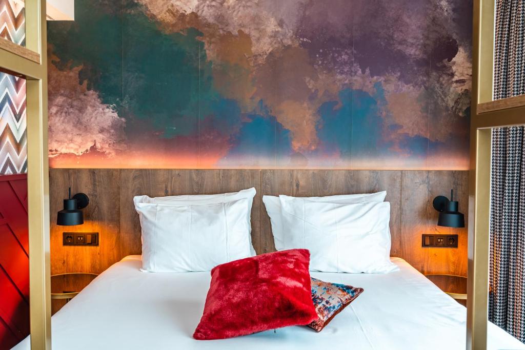 Postel nebo postele na pokoji v ubytování Hotel Haarhuis