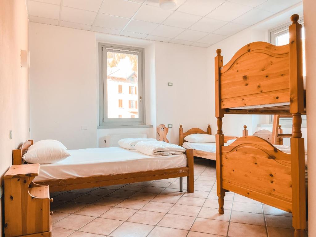 Postel nebo postele na pokoji v ubytování Casa del Parco Adamello