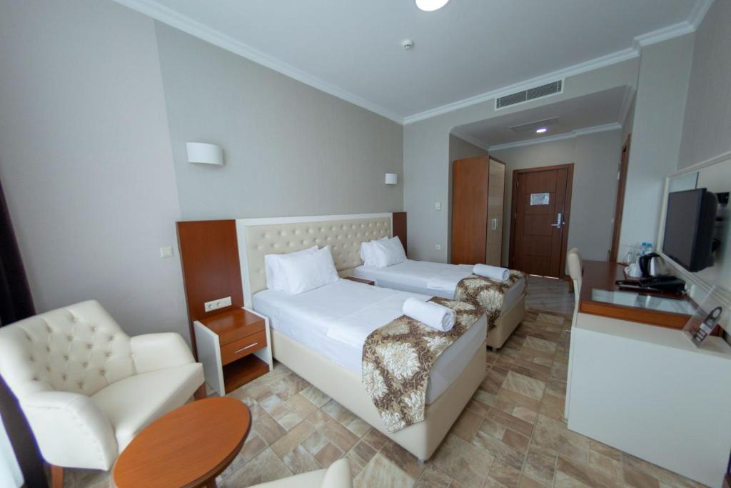 TV a/nebo společenská místnost v ubytování Era Palace Gonio