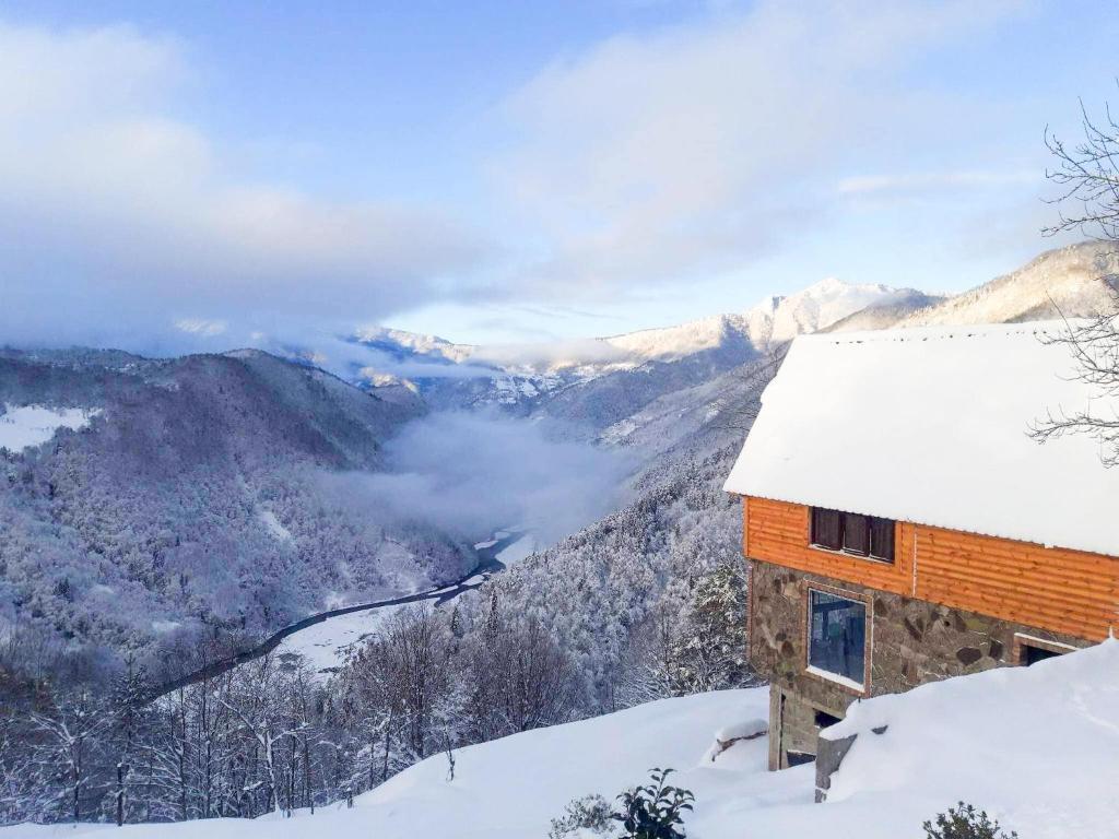 a cabin in the snow on a mountain at Highland • Varjanisi in Batumi