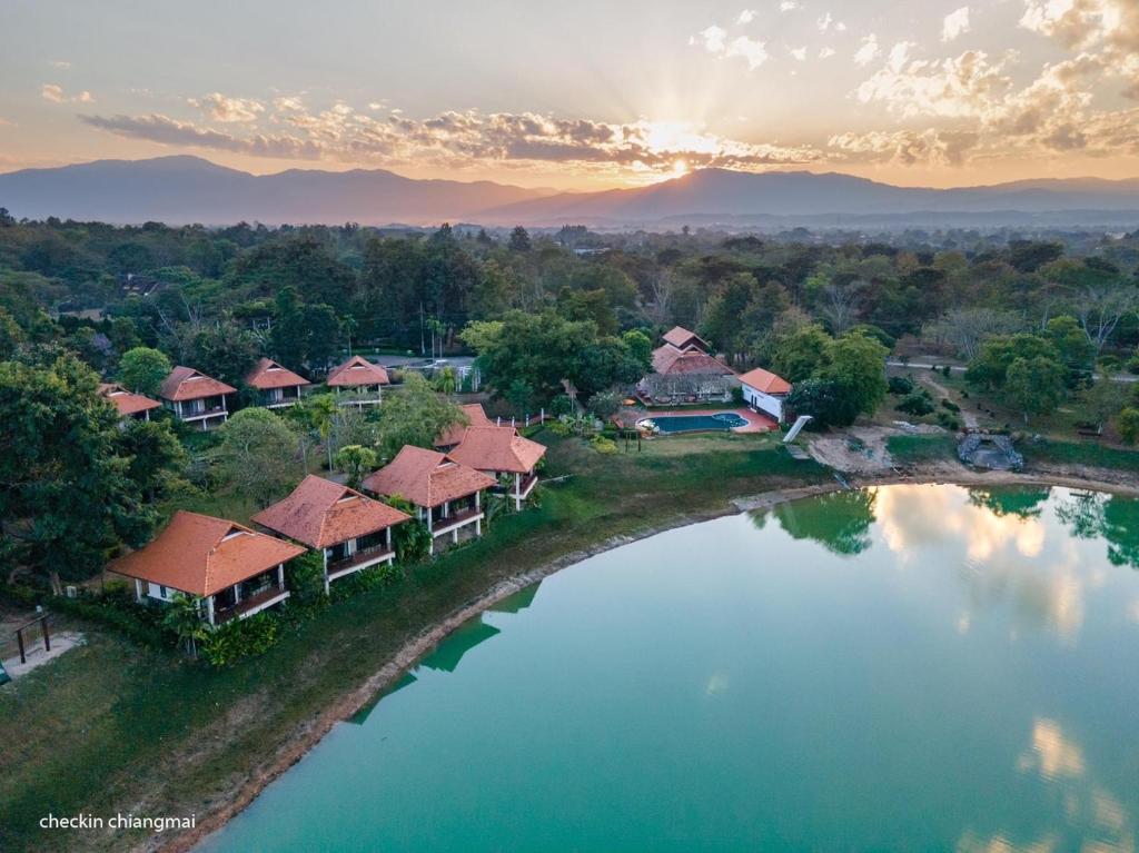 an aerial view of a resort with a lake at Lunarr Star Waterpark by Siris Stars Resort in Ban Mai