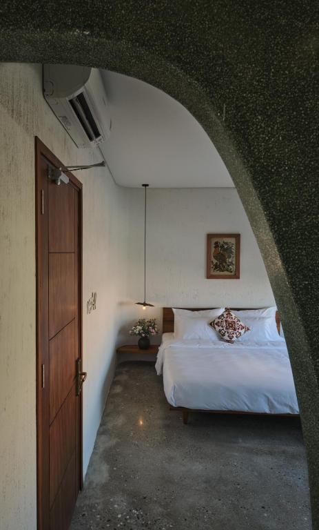 Giường trong phòng chung tại Barbados Cherry Villa