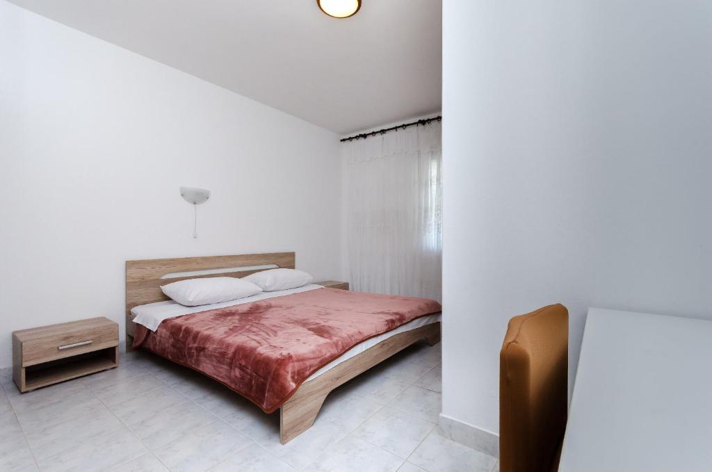 Postel nebo postele na pokoji v ubytování Apartments Luce