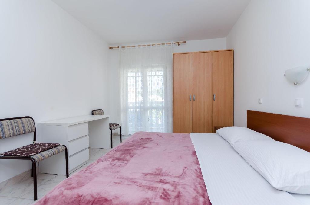 Postel nebo postele na pokoji v ubytování Apartments Luce